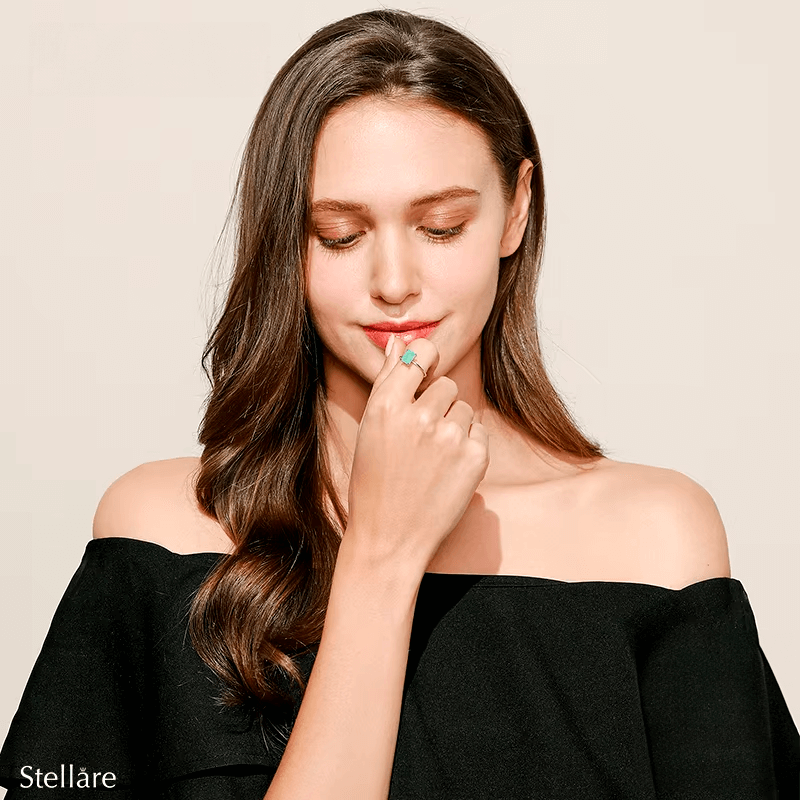 Rectangular turquoise gemstone ring set in 925 sterling silver, available in silver and gold finishes. Elegant, modern, and minimalist style
