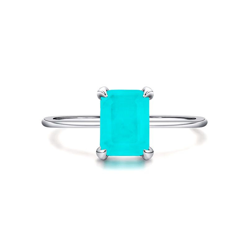 Rectangular turquoise gemstone ring set in 925 sterling silver, available in silver and gold finishes. Elegant, modern, and minimalist style