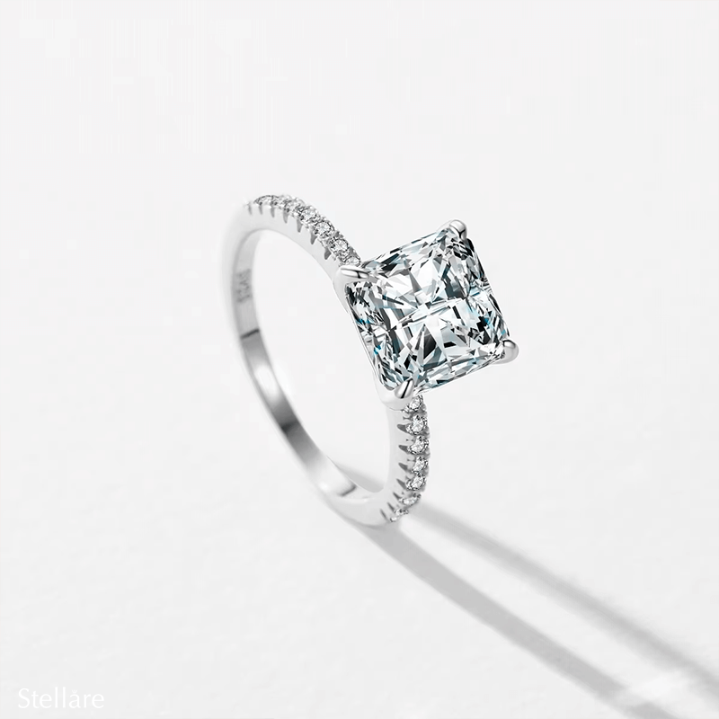 Sterling silver ring with square-cut zirconia stone and pavé band, photographed in different elegant angles and worn on the hand.