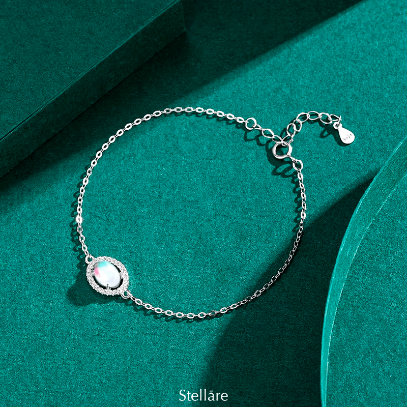 925 sterling silver bracelet with a central luminous opal stone and celestial-inspired design