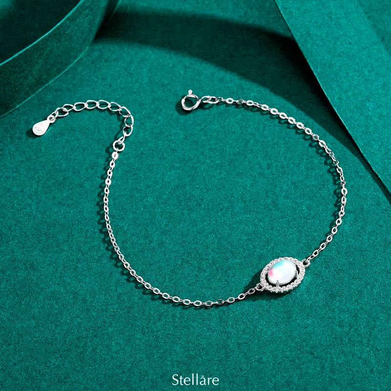 925 sterling silver bracelet with a central luminous opal stone and celestial-inspired design