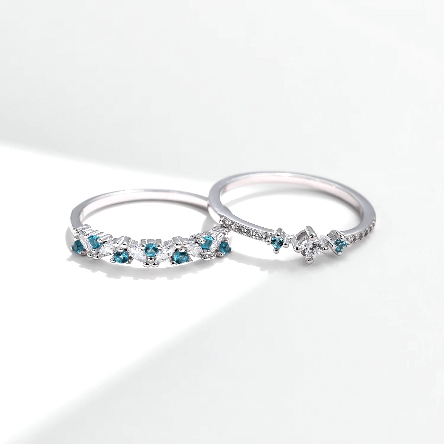“Sterling silver ring set with blue zirconia – delicate and stackable duo for elegant everyday wear or gifting”