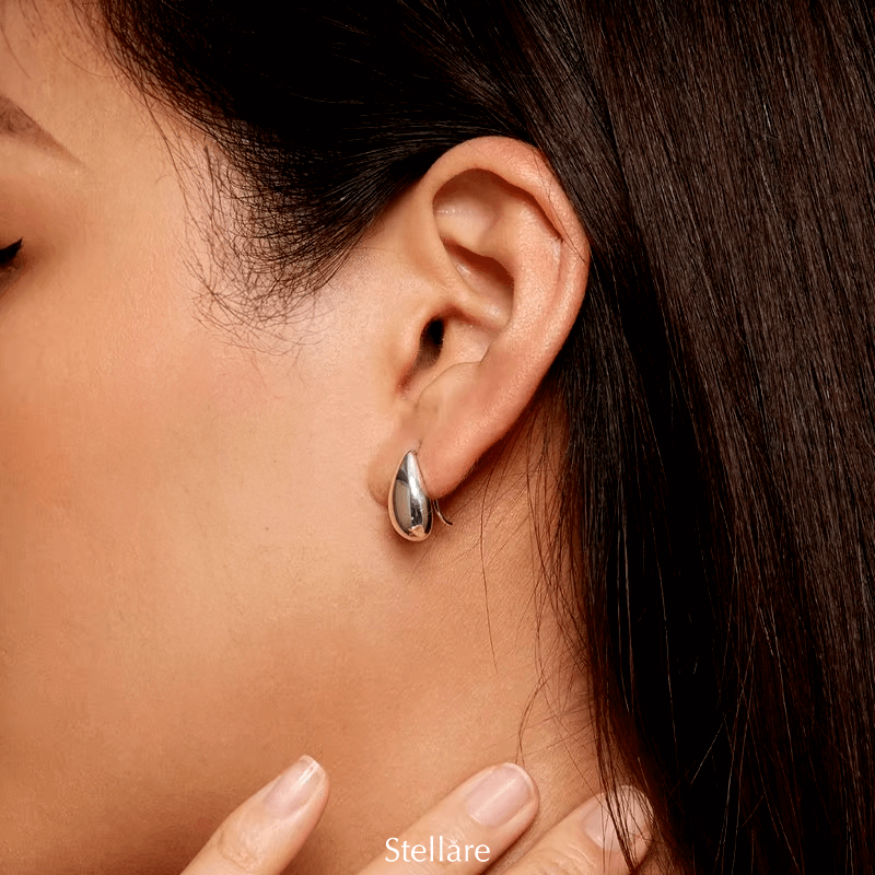 Sterling silver drop earrings with smooth polished teardrop design – minimalist and elegant for daily or formal wear