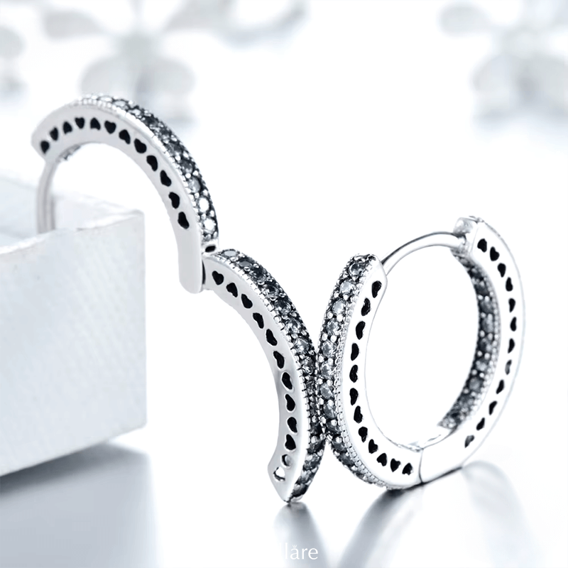 Sterling silver hoop earrings with heart-cut details and zirconia – symbolic, stylish and elegant design for everyday or gifting