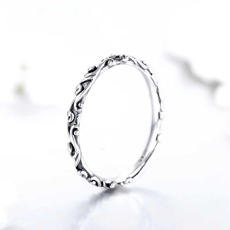 Sterling silver floral ring set with engraved nature-inspired patterns – stackable duo in silver and rose tones for romantic everyday wear
