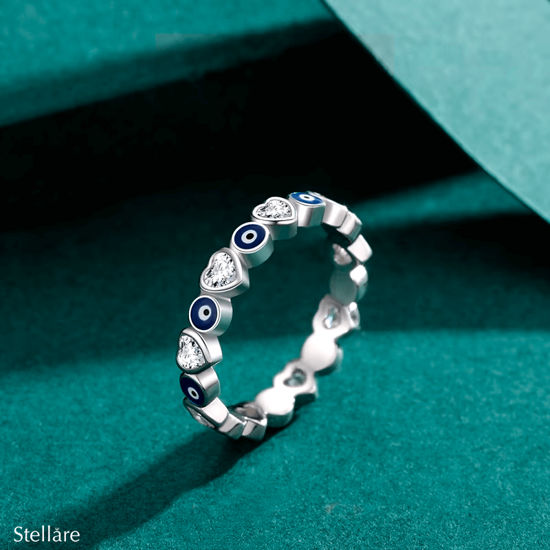 Sterling silver evil eye ring with heart motifs – protective and symbolic jewellery piece in minimalist style