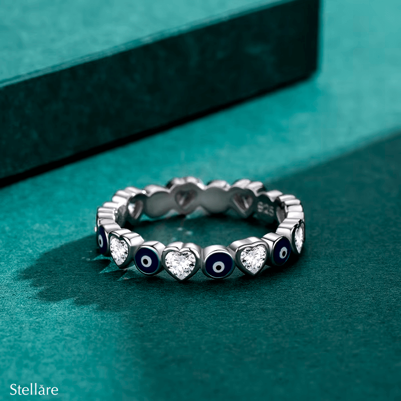 Sterling silver evil eye ring with heart motifs – protective and symbolic jewellery piece in minimalist style