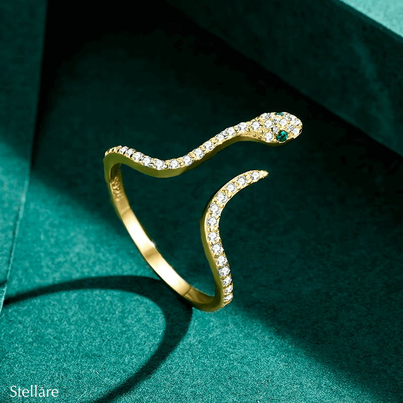 Sterling silver snake ring with pavé zirconia and green stone eyes – bold, symbolic and adjustable design