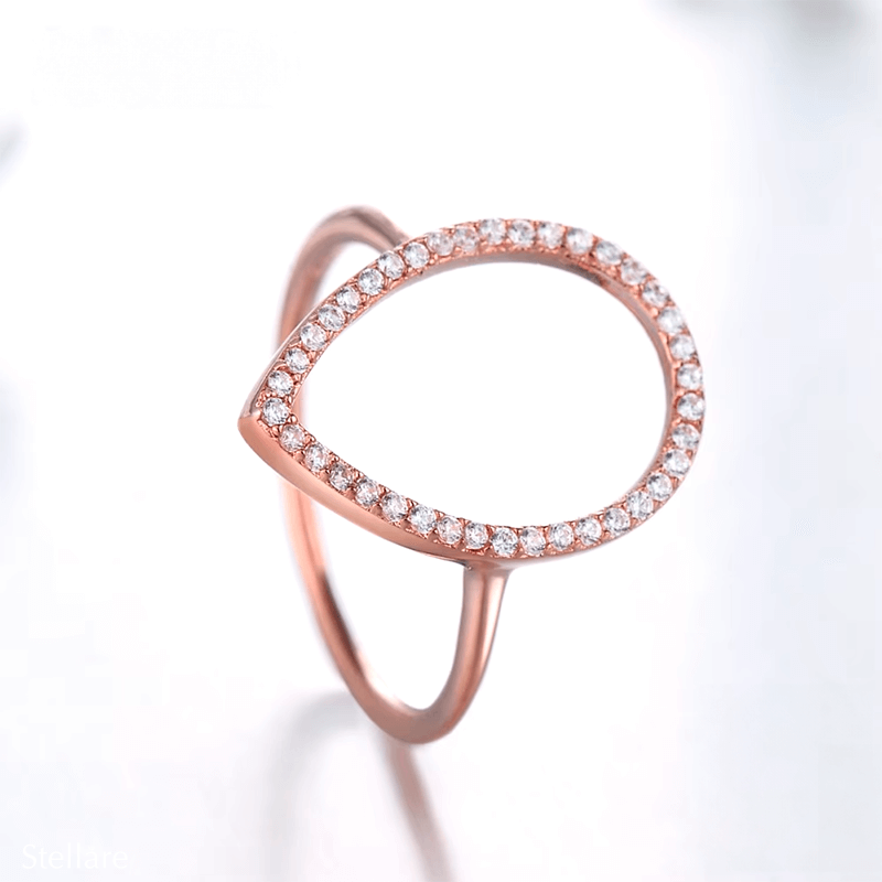 Sterling silver teardrop ring with pavé zirconia – modern open band design in silver or rose gold