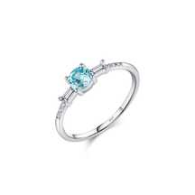 Colorful 925 sterling silver gemstone rings with heart, round, and baguette stones, worn in combination or shown individually