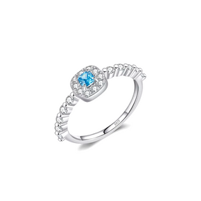 Colorful 925 sterling silver gemstone rings with heart, round, and baguette stones, worn in combination or shown individually