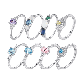 Colorful 925 sterling silver gemstone rings with heart, round, and baguette stones, worn in combination or shown individually