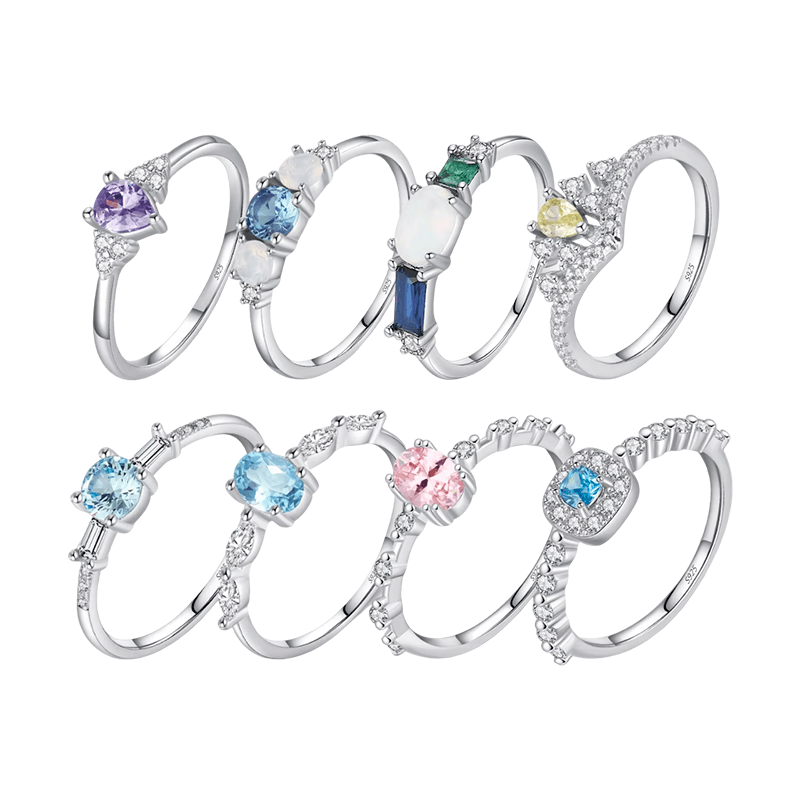 Colorful 925 sterling silver gemstone rings with heart, round, and baguette stones, worn in combination or shown individually