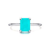 Rectangular turquoise gemstone ring set in 925 sterling silver, available in silver and gold finishes. Elegant, modern, and minimalist style