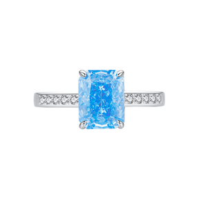 925 sterling silver ring featuring a radiant-cut blue topaz stone with side zirconia accents, shown on hand and in elegant close-up angles