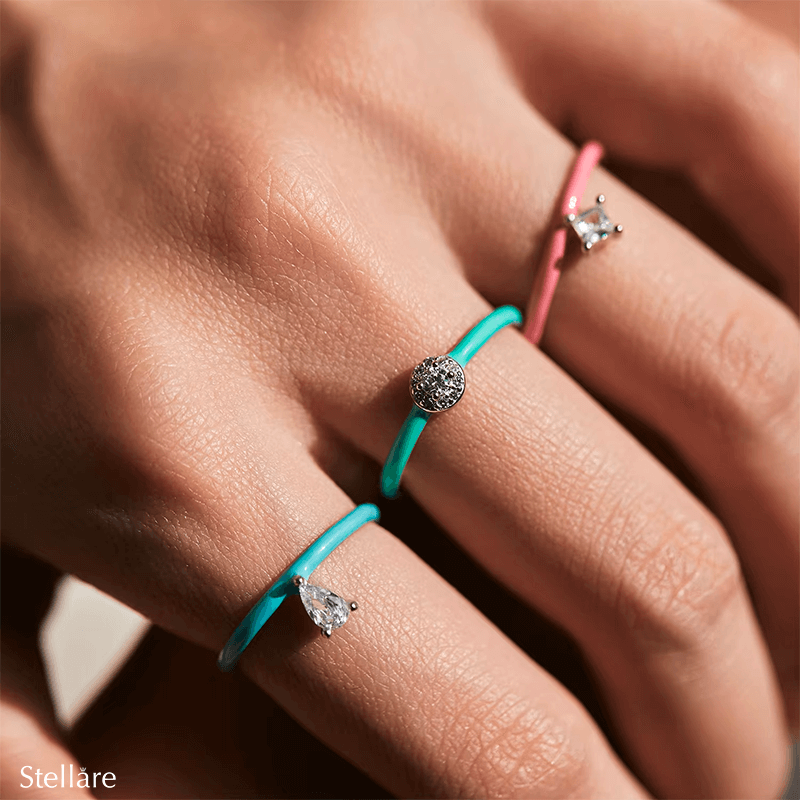 Vibrant candy-style rings in 925 sterling silver, available in multiple pastel colours with enamel finish and zirconia details, ideal for stacking or solo wear