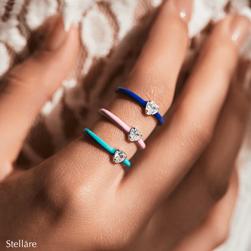 Vibrant candy-style rings in 925 sterling silver, available in multiple pastel colours with enamel finish and zirconia details, ideal for stacking or solo wear