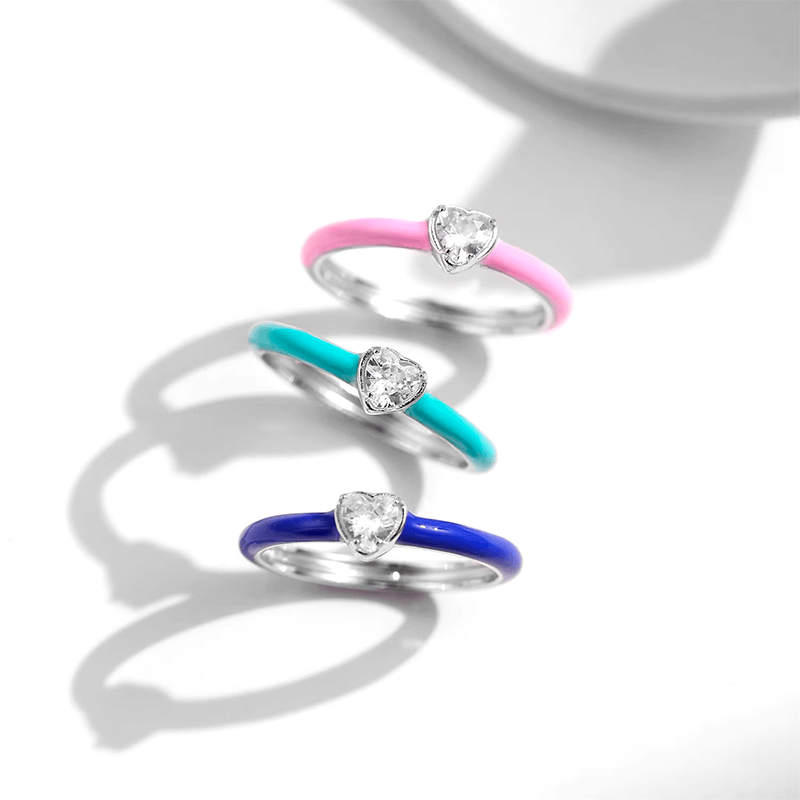 Vibrant candy-style rings in 925 sterling silver, available in multiple pastel colours with enamel finish and zirconia details, ideal for stacking or solo wear