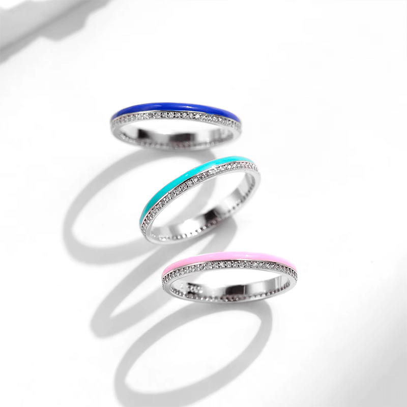 Vibrant candy-style rings in 925 sterling silver, available in multiple pastel colours with enamel finish and zirconia details, ideal for stacking or solo wear