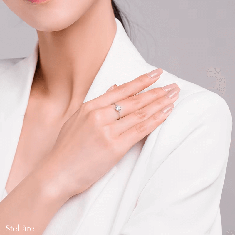 925 sterling silver rings with various gemstone settings, including cushion, round and pear cuts — displayed individually and on model's hand