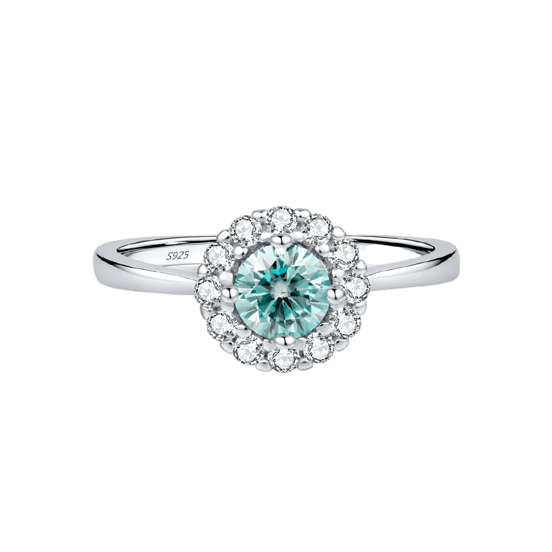 925 sterling silver ring featuring an ocean-blue centre stone encircled by brilliant white zirconia, shown on model and close-up