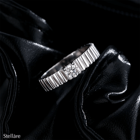 925 sterling silver ring with modern vertical grooves and center zirconia, shown on hand and in close-up with soft black background.