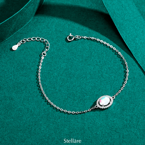925 sterling silver bracelet with a central luminous opal stone and celestial-inspired design