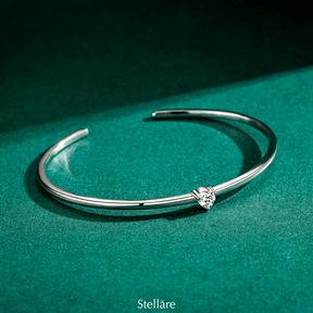 Elegant open cuff bracelet in 925 sterling silver with central sparkling stone