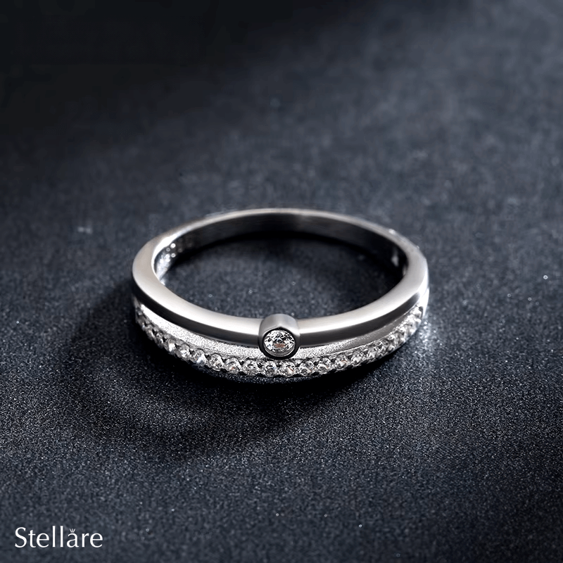 “Sterling silver curved ring with solitaire cubic zirconia – elegant minimalist band for daily wear”
