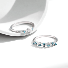 “Sterling silver ring set with blue zirconia – delicate and stackable duo for elegant everyday wear or gifting”