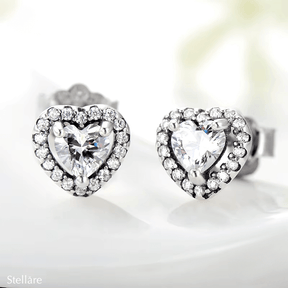 Sterling silver stud earrings with brilliant heart-shaped zirconia and halo setting – romantic and elegant design