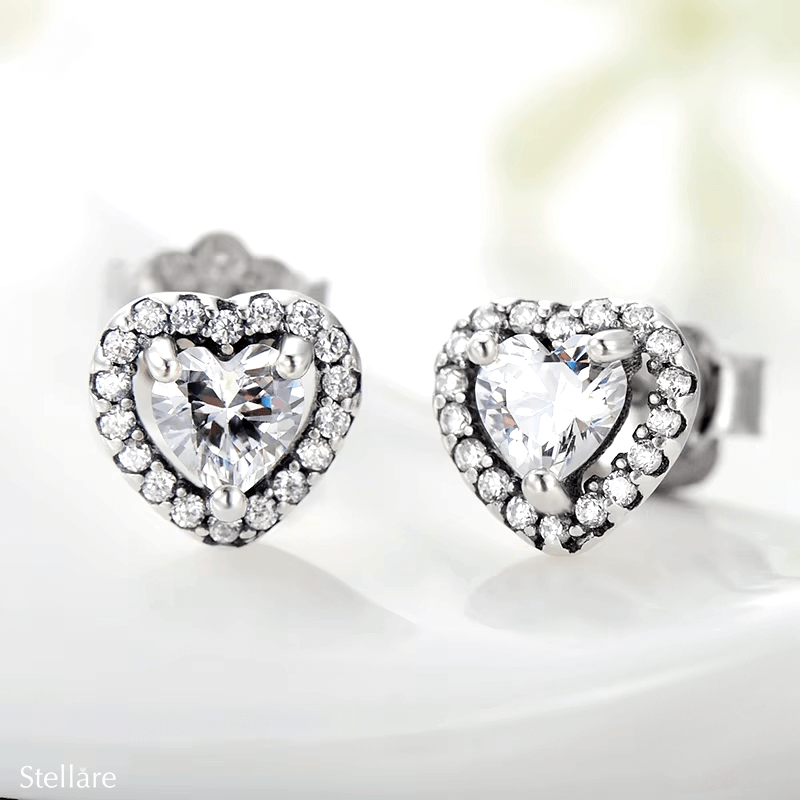 Sterling silver stud earrings with brilliant heart-shaped zirconia and halo setting – romantic and elegant design