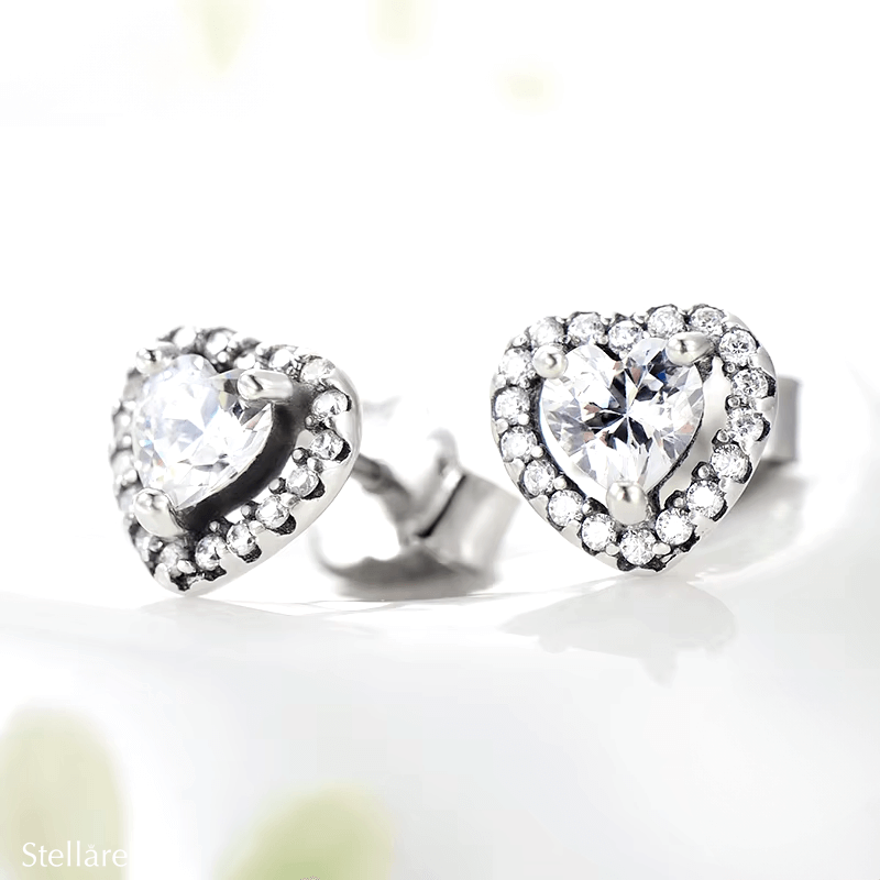 Sterling silver stud earrings with brilliant heart-shaped zirconia and halo setting – romantic and elegant design