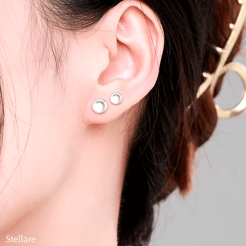 Sterling silver stud earrings with luminous blue stones – celestial-inspired design for elegance and serenity