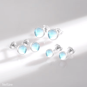 Sterling silver stud earrings with luminous blue stones – celestial-inspired design for elegance and serenity