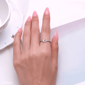 Sterling silver chevron ring with heart-cut blue zirconia and pavé band – dainty and elegant feminine design