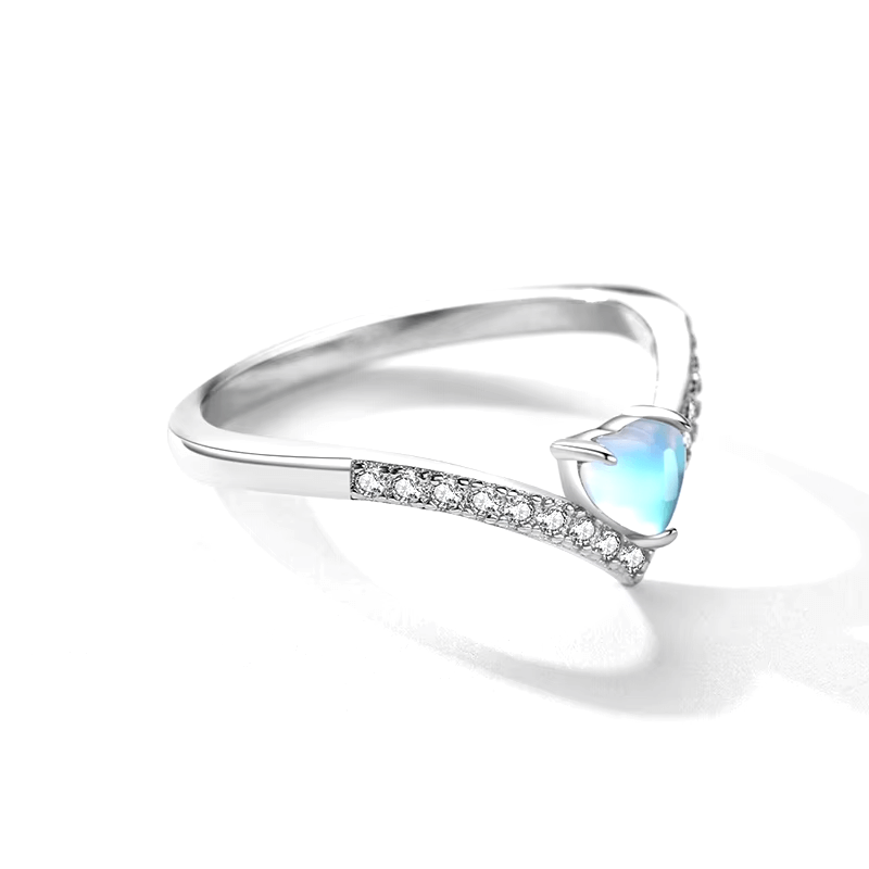 Sterling silver chevron ring with heart-cut blue zirconia and pavé band – dainty and elegant feminine design