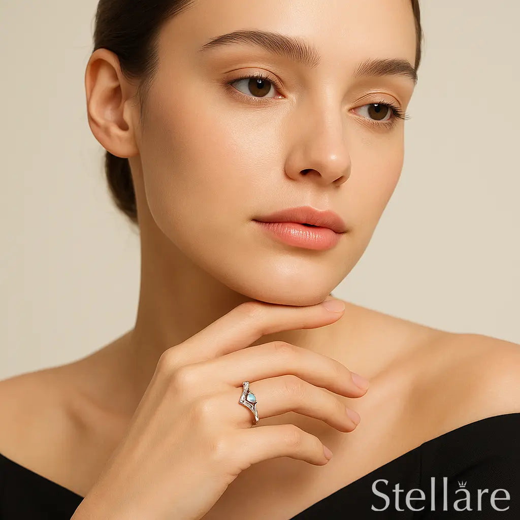 Sterling silver chevron ring with heart-cut blue zirconia and pavé band – dainty and elegant feminine design