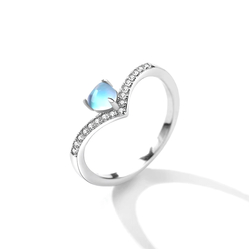 Sterling silver chevron ring with heart-cut blue zirconia and pavé band – dainty and elegant feminine design