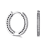 Sterling silver hoop earrings with heart-cut details and zirconia – symbolic, stylish and elegant design for everyday or gifting
