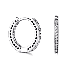 Sterling silver hoop earrings with heart-cut details and zirconia – symbolic, stylish and elegant design for everyday or gifting