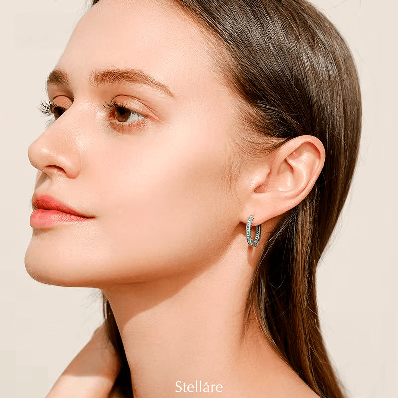 Sterling silver hoop earrings with heart-cut details and zirconia – symbolic, stylish and elegant design for everyday or gifting