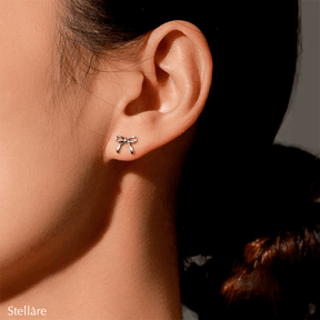 Sterling silver stud earrings in delicate bow shape – dainty knot design symbolising connection and elegance