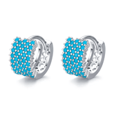 Sterling silver geometric stud earrings with textured turquoise design – bold and modern for elegant everyday looks