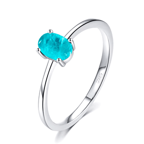 Sterling silver ring with bright oval-cut blue gemstone – minimalist and elegant band for everyday wear