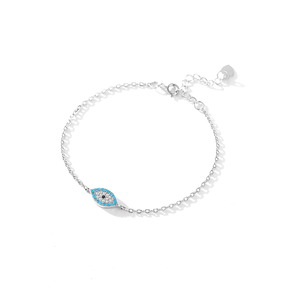 Sterling silver bracelet with blue evil eye charm – minimalist protection jewellery with spiritual meaning and elegance