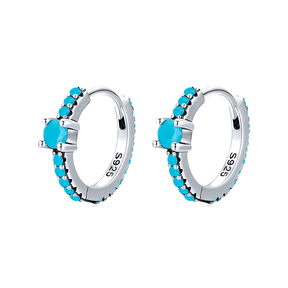 Sterling silver hoop earrings with turquoise stones and central blue charm – elegant and vibrant for stylish everyday wear